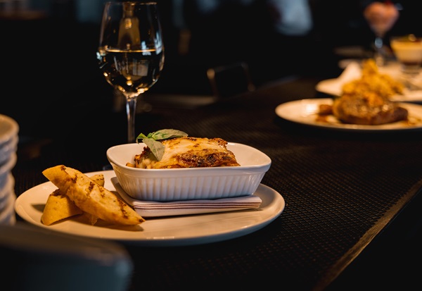 A few plates of food on a table at a restaurant