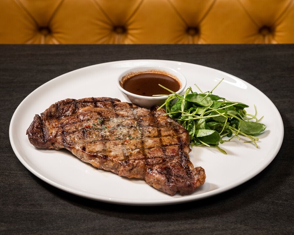 Ribeye steak with greens