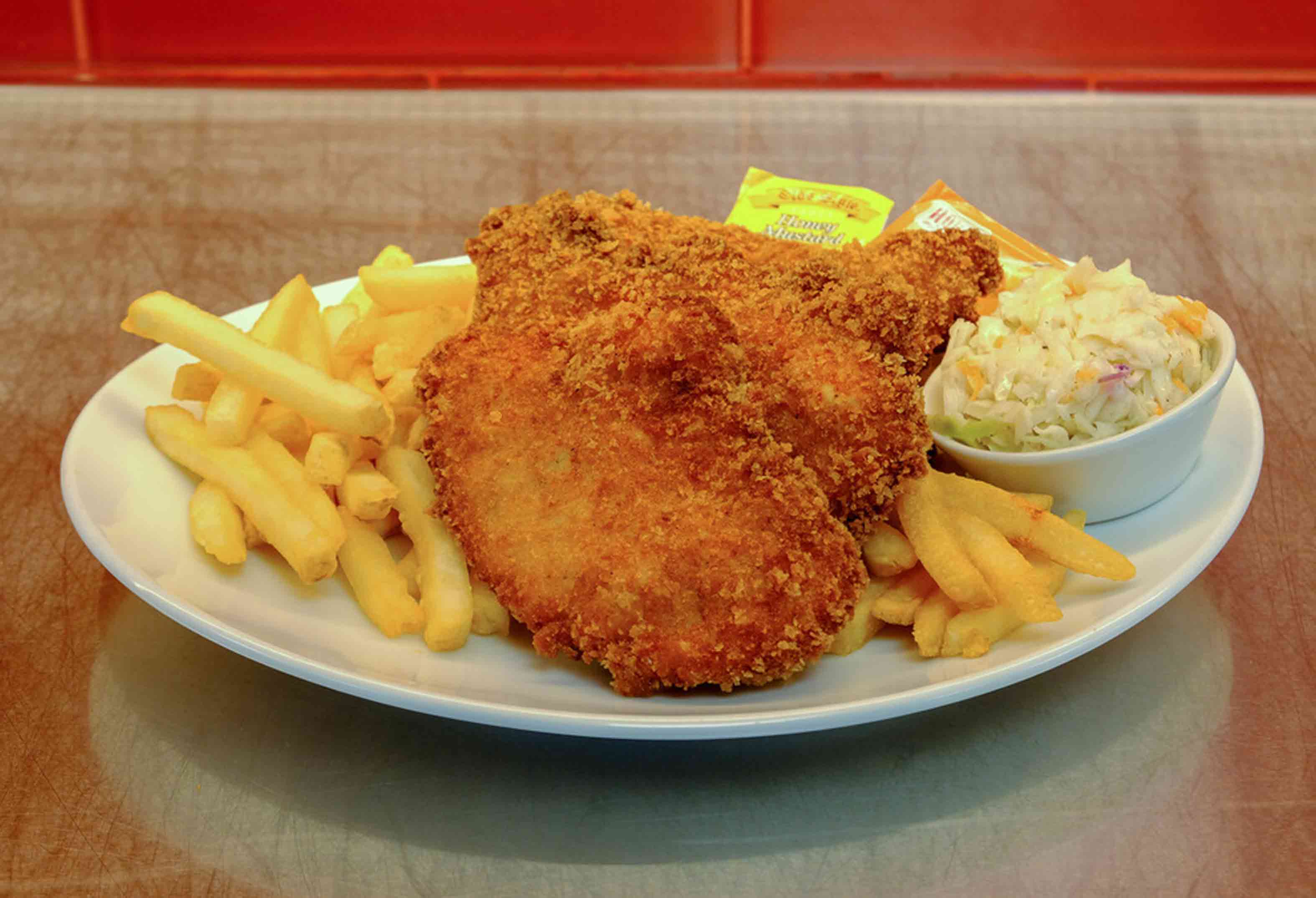 fried chicken, fries and coleslaw at Mr. Lucky's