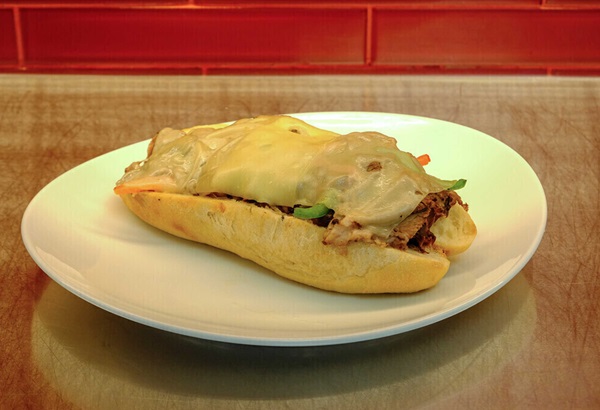 sandwich with melted cheese at Mr. Lucky's