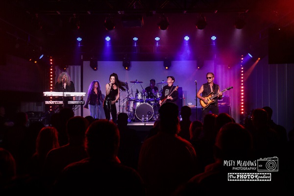 Music group performing at a concert