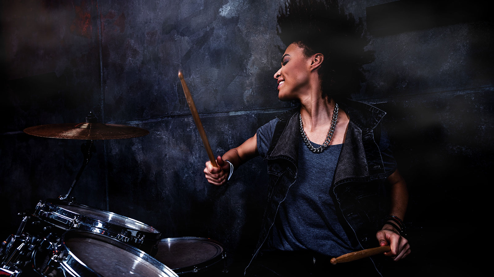 Woman playing the drums